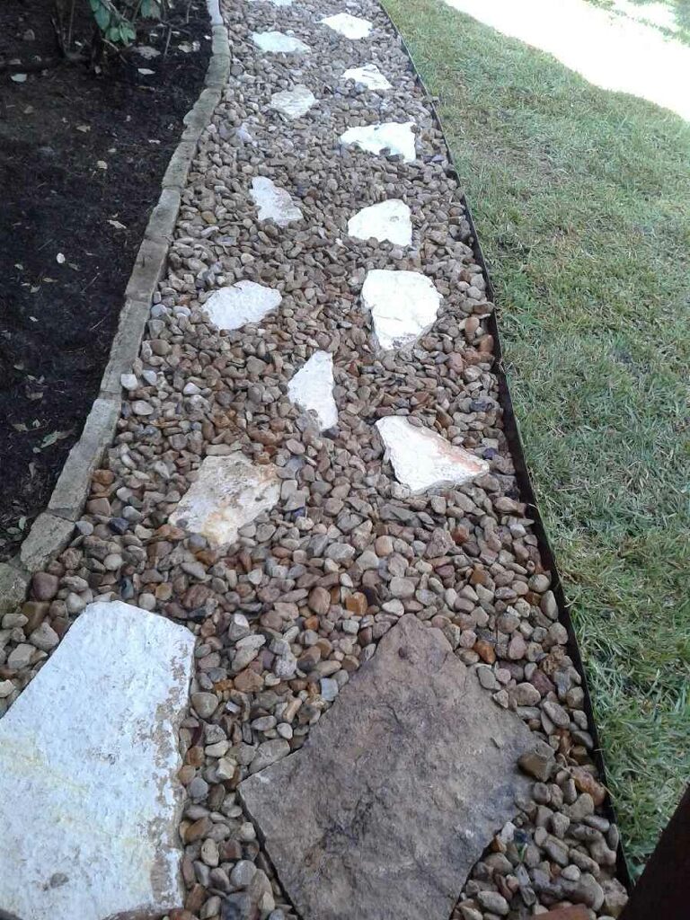 https://www.grassworksaustin.com/wp-content/uploads/2022/07/Grass-Works-Lawn-Care-Austin-Landscape-Rock-Path-2.jpg