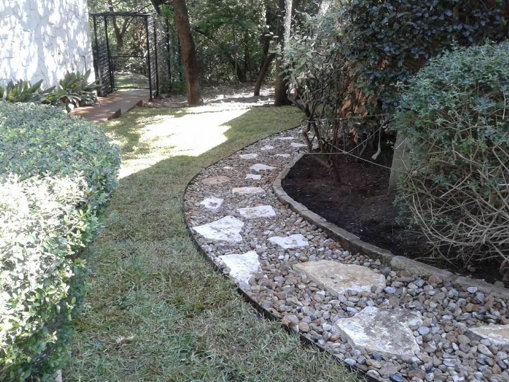 https://www.grassworksaustin.com/wp-content/uploads/2022/07/Grass-Works-Lawn-Care-Austin-Landscape-Rock-Path.jpg