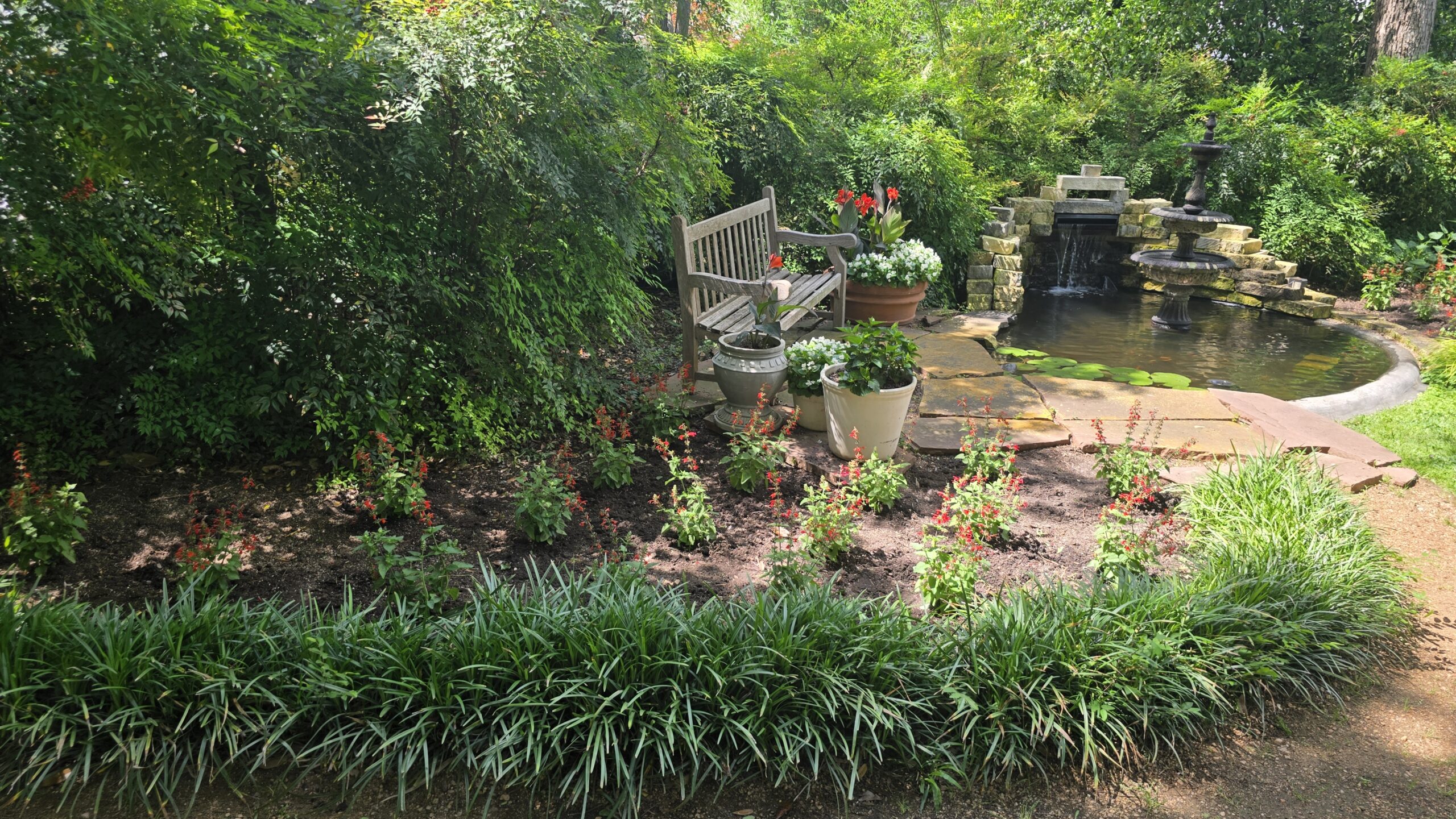 UT Bauer House pond and bench scaled